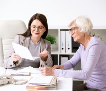 insurance broker helping senior woman with medicare