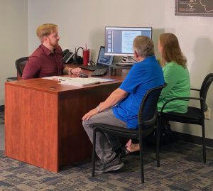 senior Medicare clients at TCU broker desk