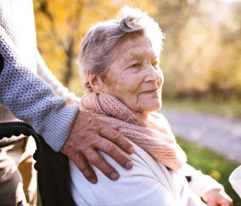 elderly woman in long term care outdoors